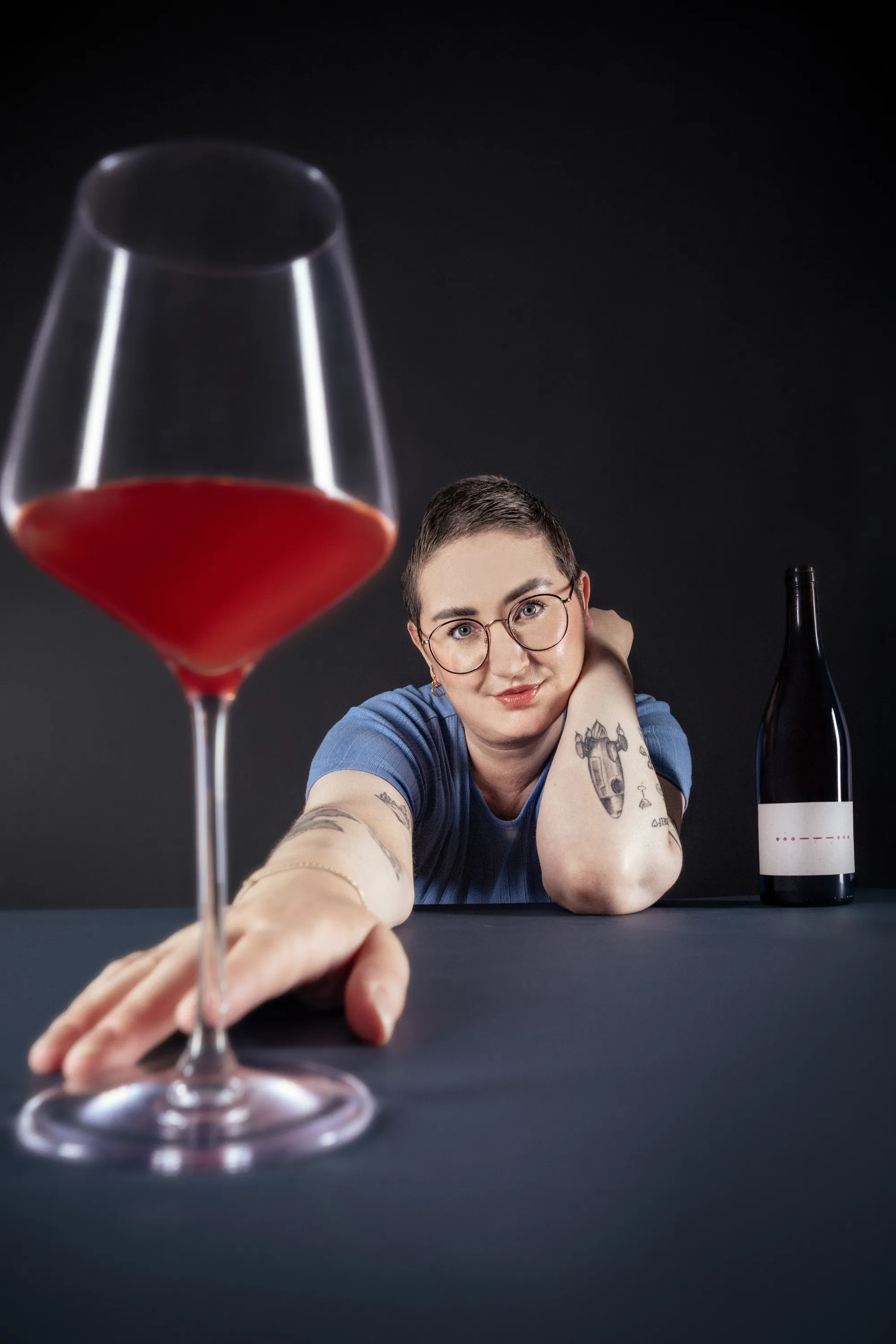 Editorial portrait with a glass of red wine