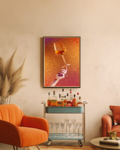 A framed Print of a wine glass in a living room
