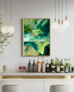 A framed print of a cocktail above a bar