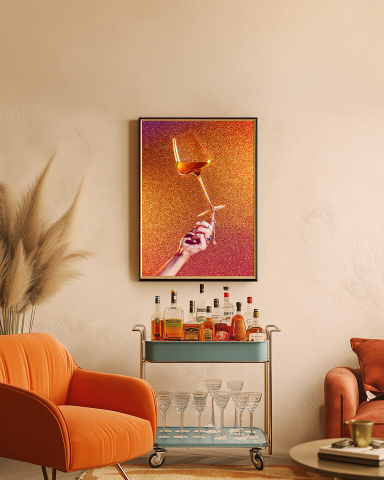 Living room with orange armchair and framed fine art print of a wine glass on hand, by Düsseldorf creative studio